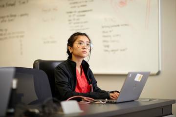 A nursing student at a laptop